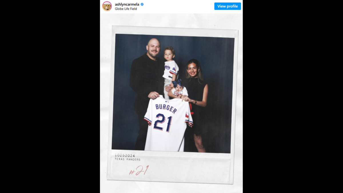 Jake Burger and his wife, Ashlyn Burger, pose for a photo with their son Brooks and daughter Penelope.