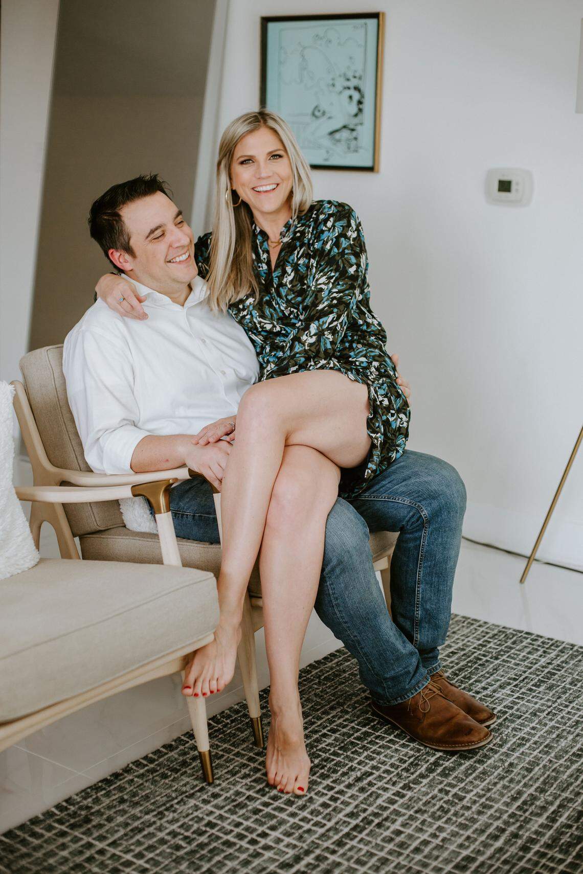 Ben Katz and Jamie Webner pose for their engagement photo, which was taken at their Brickell apartment, the same venue they used for their wedding amid the coronavirus pandemic. Make up by Cynthia Martens @cynfulmakeup.