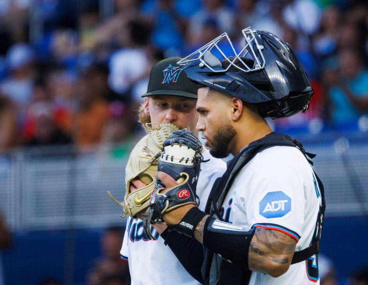 Miami Marlins starting pitcher Max Meyer (23) talks to catcher Agustín Ramírez (50), who had his MLB debut,  during the first inning of a game on Monday, April 21, 2025, at loan Depot Park in Miami, Fla. 