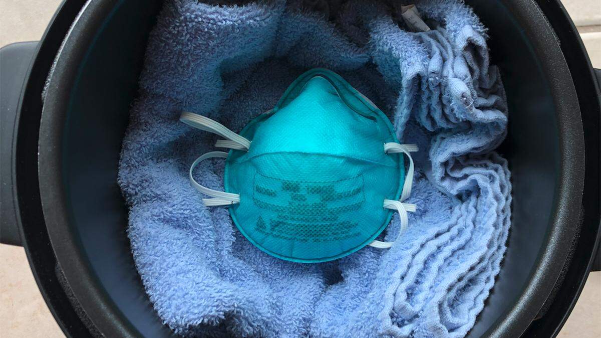 Electric cookers can disinfect N95 masks in one 50-minute cycle under dry heat while keeping their filtration and fit. This could help hospitals and clinics with mask shortages during the coronavirus pandemic.