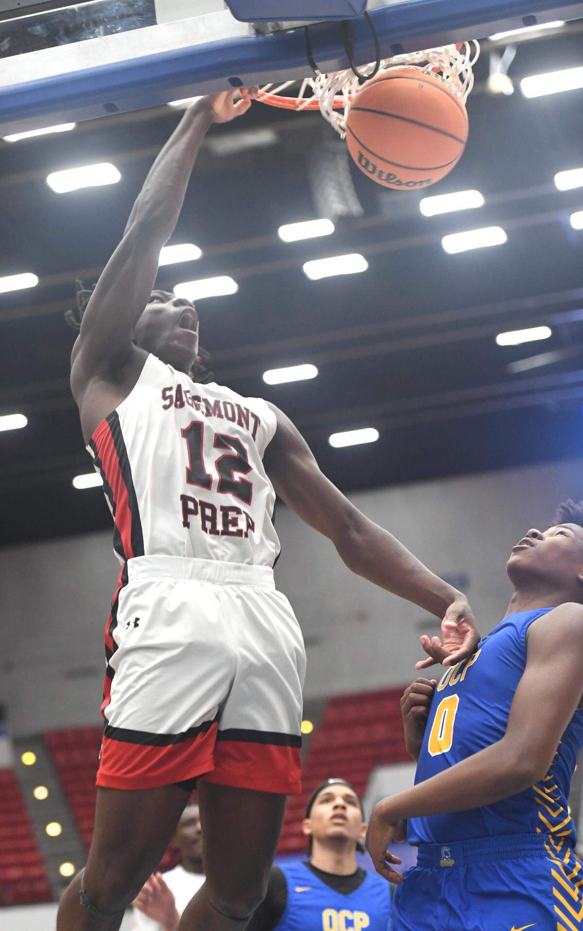 Sagemont’s Devontae Jean(12) ices the game in the final seconds with a slam dunk against Orlando Christian Prep in the Class 2A final during the Florida High School State Championships at the RP Funding Center in Lakeland, Fl on Thursday February 29, 2024. Sagemont defeated Orlando Christian Prep 50-47. Scott Wheeler | Photo