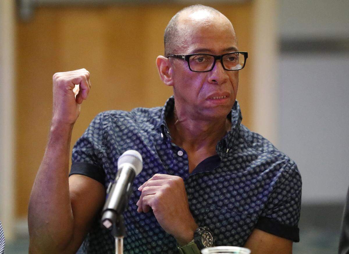 Esteban Barrios, an airport ramp worker with Eulen America, speaks during a round table discussion on hazardous conditions at Miami International Airport, with Reps. Donna Shalala, and Frederica Wilson, D-Fla., Wednesday, April 24, 2019, in Miami. Workers spoke about inhumane, dangerous working conditions, broken-down airport vehicles and roach infestations they must work with. (AP Photo/Wilfredo Lee)