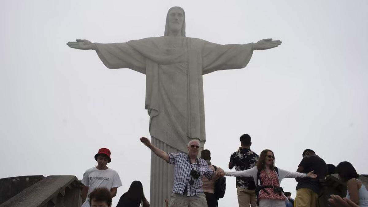 Tourists visit the Christ the Redeemer statue in Rio de Janeiro. Brazil gets only 4% of its tourism income from foreign travelers.