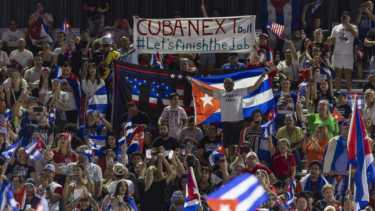 People wave flags as they attend the Free Cuba Rally at Milander Park on Tuesday, March 24, 2026, in Hialeah, Fla. The demonstration, which was organized in part by the City of Hialeah, aims to bring together voices of the Cuban exile community in support of Cuba's freedom.