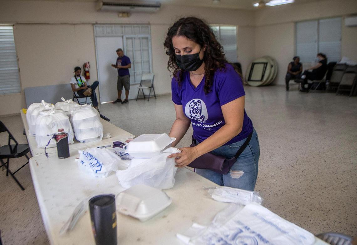 Jenifer de Jesus, director of Taller Salud, packed some lunches at the soup kitchen created by the non profit group in Loíza, that mobilize to respond to Fiona in the town of Loíza on the northeastern coast of Puerto Rico as the hurricane passed by the island on Monday September 18, on Wednesday, September 21, 2022.