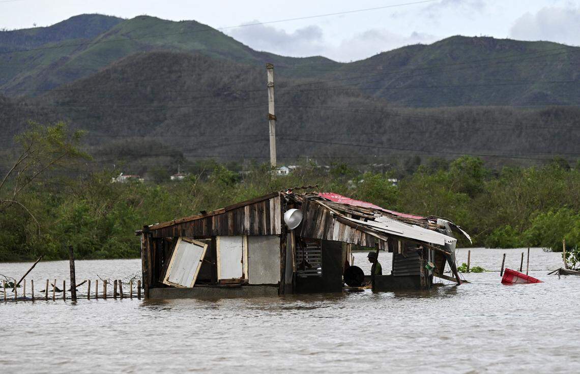 A farmer remains inside his flooded house after the passage of Hurricane Melissa through the town of San Miguel de Parada in Santiago de Cuba province on Oct. 29, 2025.