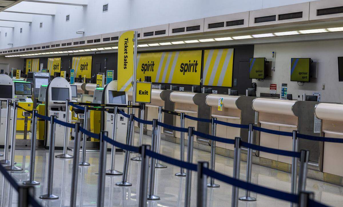 The deserted Spirit counters at Fort Lauderdale-Hollywood International Airport after the airline shut down on Saturday, May 2, 2026.