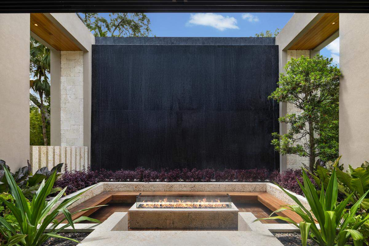 This conversation pit is set in front of a “fountain wall.”