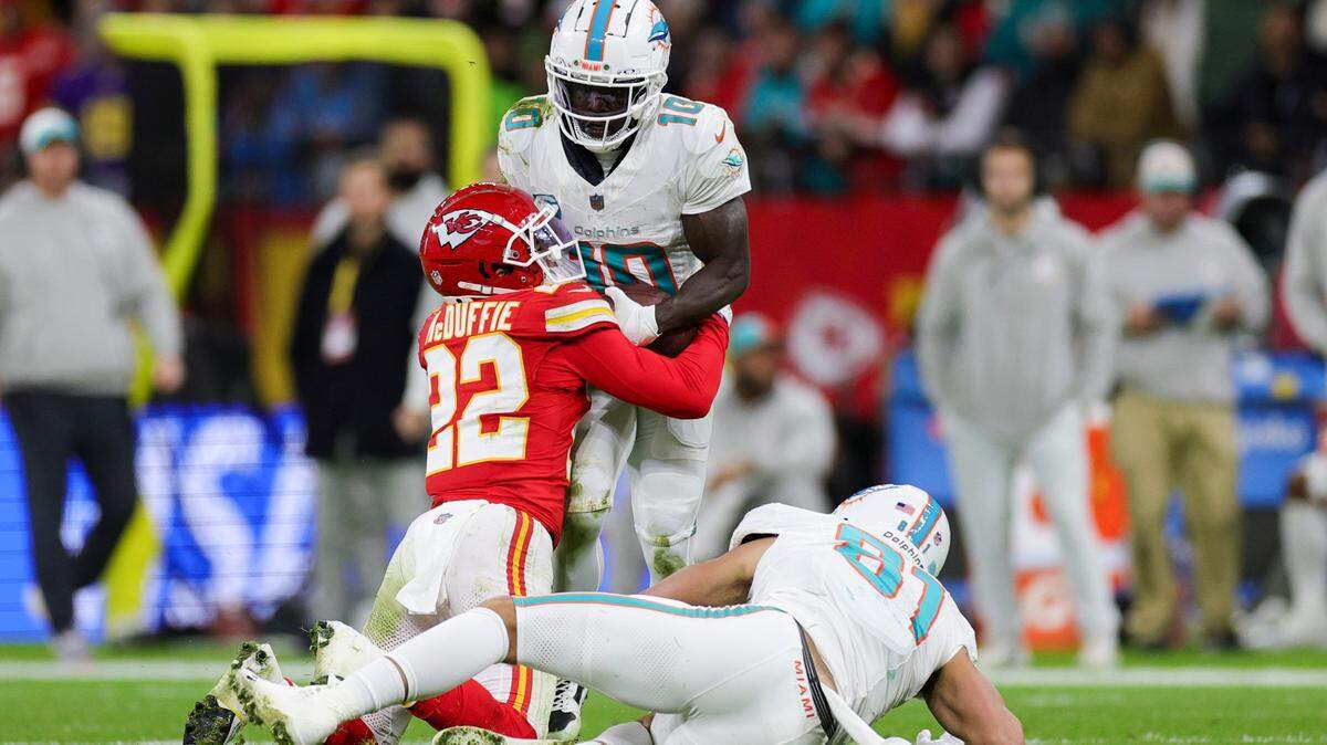 Nov 5, 2023; Frankfurt, Germany, ; Kansas City Chiefs cornerback Trent McDuffie (22) forces a fumble by Miami Dolphins wide receiver Tyreek Hill (10) in the second quarter during an NFL International Series game at Deutsche Bank Park. Mandatory Credit: Nathan Ray Seebeck-USA TODAY Sports