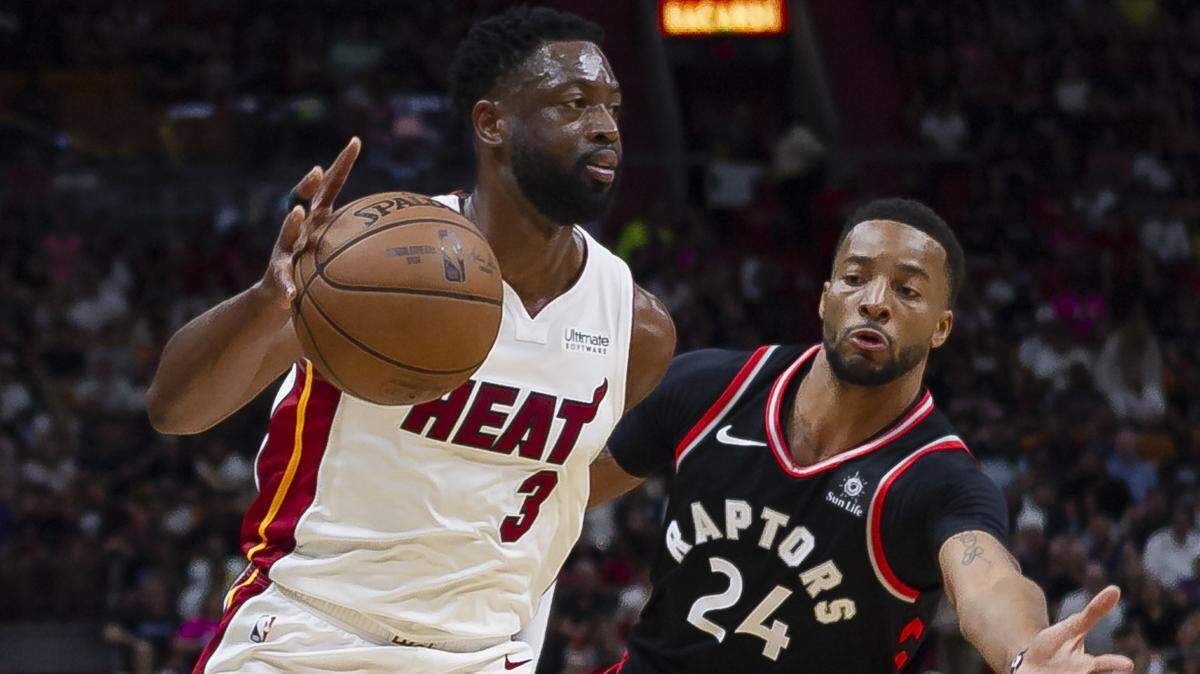 Miami Heat guard Dwyane Wade (3) drives the ball down the court while Toronto Raptors guard Norman Powell (24) defends during the second quarter of an NBA basketball game at the AmericanAirlines Arena in downtown Miami on March 10, 2019.