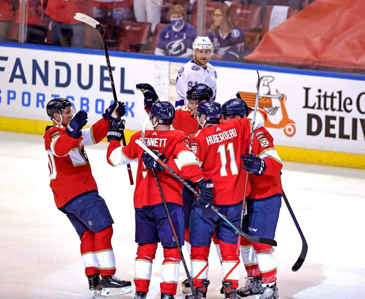 Florida Panthers center Aleksander Barkov (16) is congratulated by teammates after scoring against the Tampa Bay Lightning during the first period of game 1 of their first round NHL Stanley Cup series at the BB&T Center on Sunday, May 16, 2021 in Sunrise, Fl.