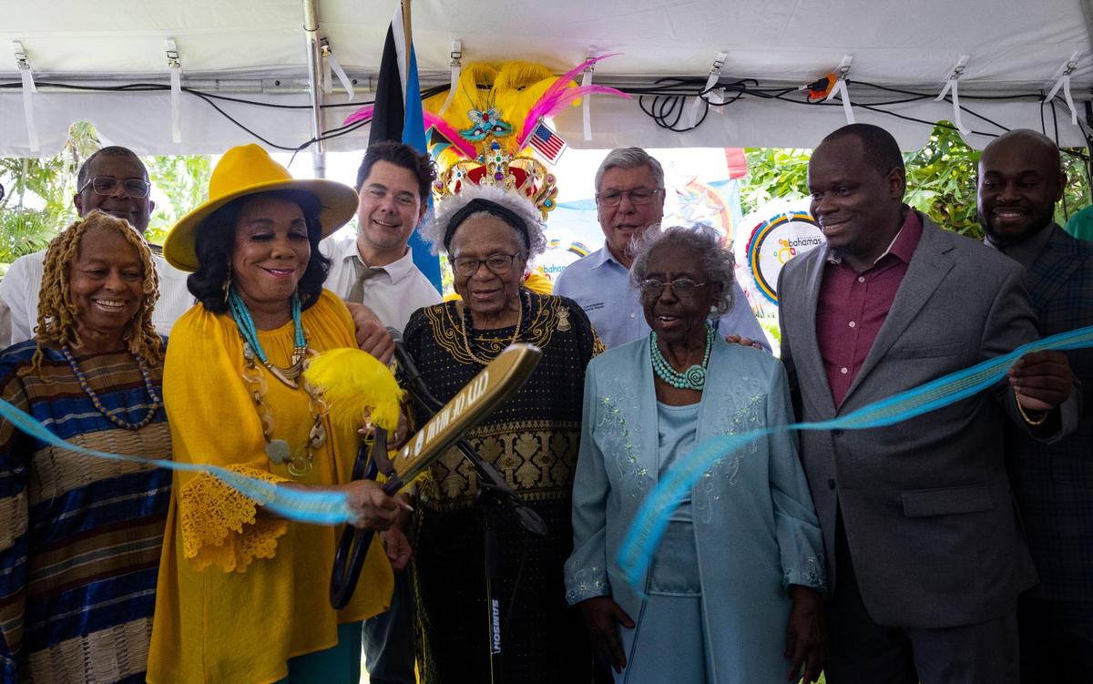 Congresswoman Frederica Wilson, left, cuts the ribbon designating Little Bahamas on Monday, Aug. 22, 2022, in Coconut Grove.