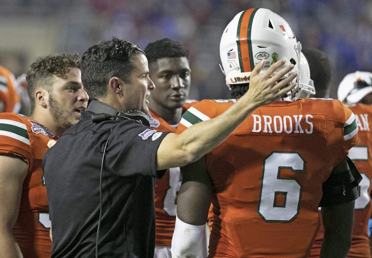 Miami Hurricanes head coach Manny Diaz with linebacker Sam Brooks Jr. (6) and players as the Miami Hurricanes play Louisiana Tech in the Walk On’s Independence Bowl at Independence Stadium in Shreveport, Louisiana on Dec. 29, 2019. Brooks had 12 tackles that day.