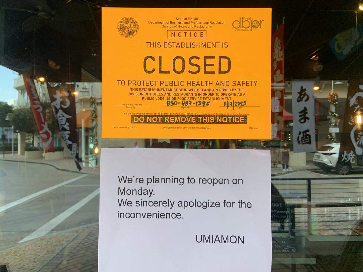 On top, the closure notice after the Nov. 17 inspection of Iron Sushi by the Florida Department of Business and Professional Regulation. On the bottom, the hopeful wish by management. Iron Sushi remained closed as of 1:15 p.m. Monday.