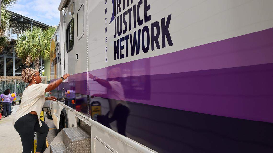 Jamarah Amani, executive director of the Southern Birth Justice Network, enters the Mobile Midwife Clinic parked at Overtown Youth Center in Miami, Florida, on Thursday, April 16, 2026.