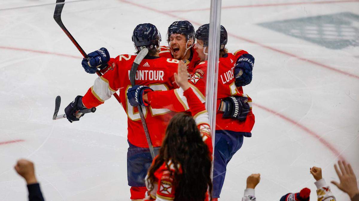 Florida Panthers center Eetu Luostarinen (27) celebrates his score against Minnesota Wild goaltender Filip Gustavsson (32) with teammates defenseman Brandon Montour (62) and center Nick Cousins (21) in the second period at FLA Live Arena in Sunrise, FL on Saturday, January 21, 2023.
