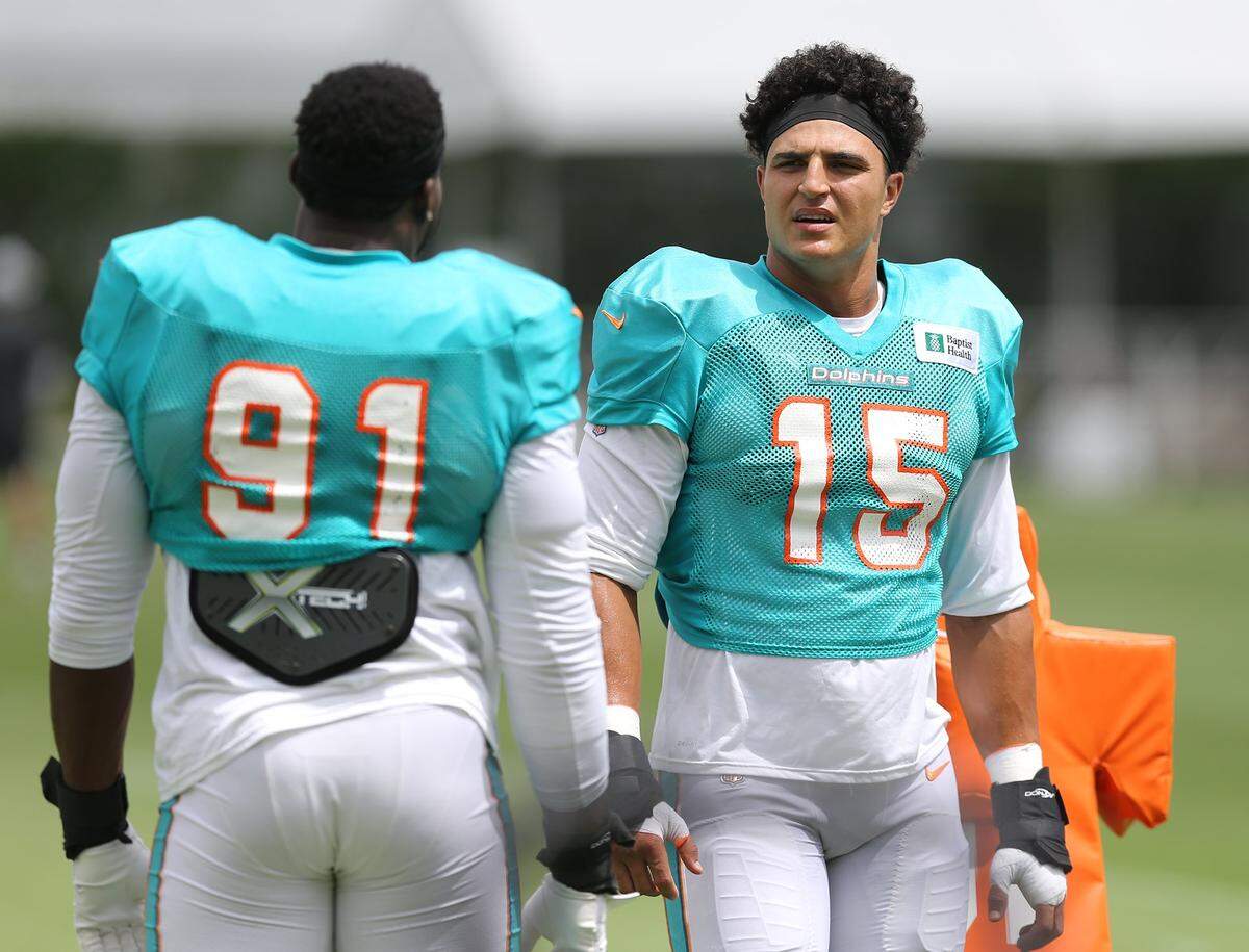 Miami Dolphins defensine end Emmanuel Ogbah (91) linebacker Jaelan Phillips (15) at the Miami Dolphins training facility at Hard Rock Stadium, Miami Gardens, Florida, August 26, 2021.