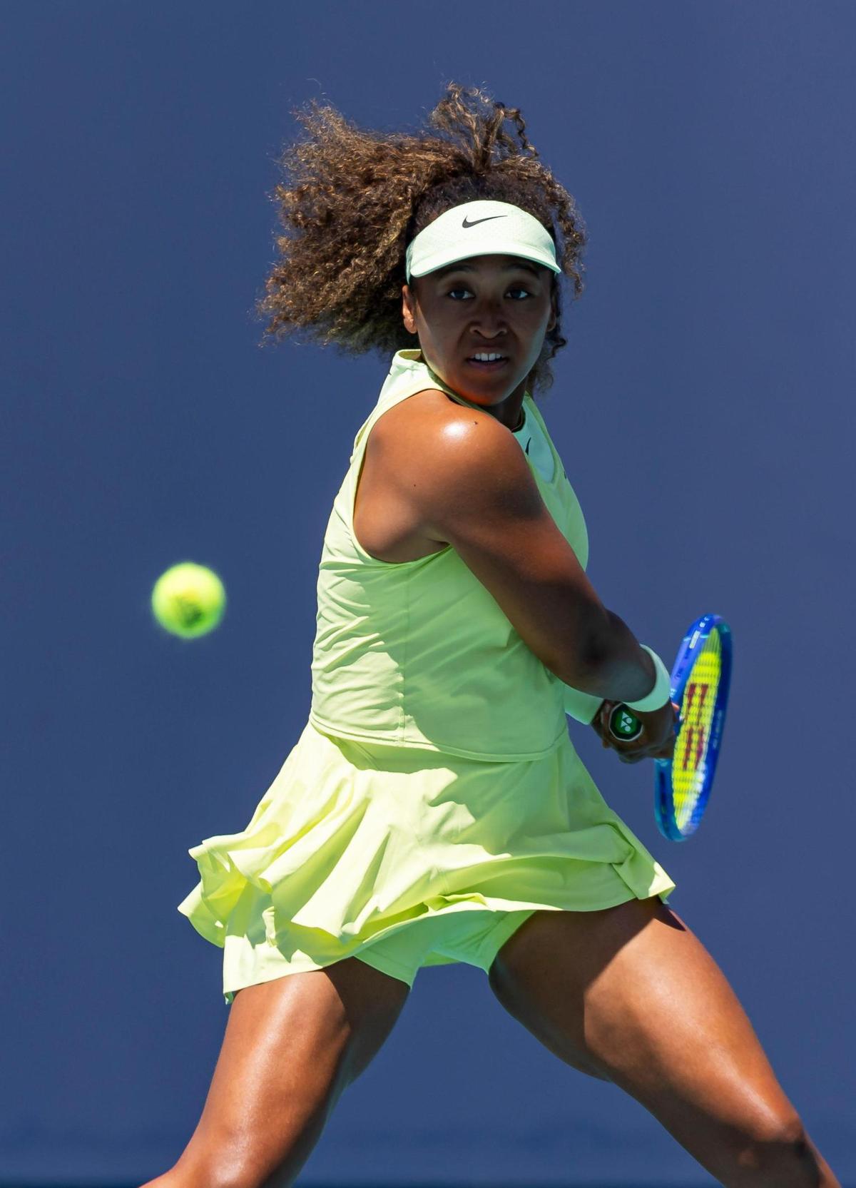 Naomi Osaka, of Japan, returns the ball to Yuliia Starodubtseva, of Ukraine, during their match at the Miami Open tennis tournament on Tuesday, March 18, 2025, at Hard Rock Stadium in Miami Gardens, Fla.