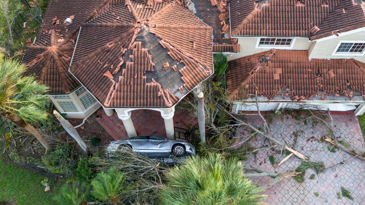 Damage to a home after a tornado ripped through The Preserve development on October 10, 2024 in Wellington, Florida.