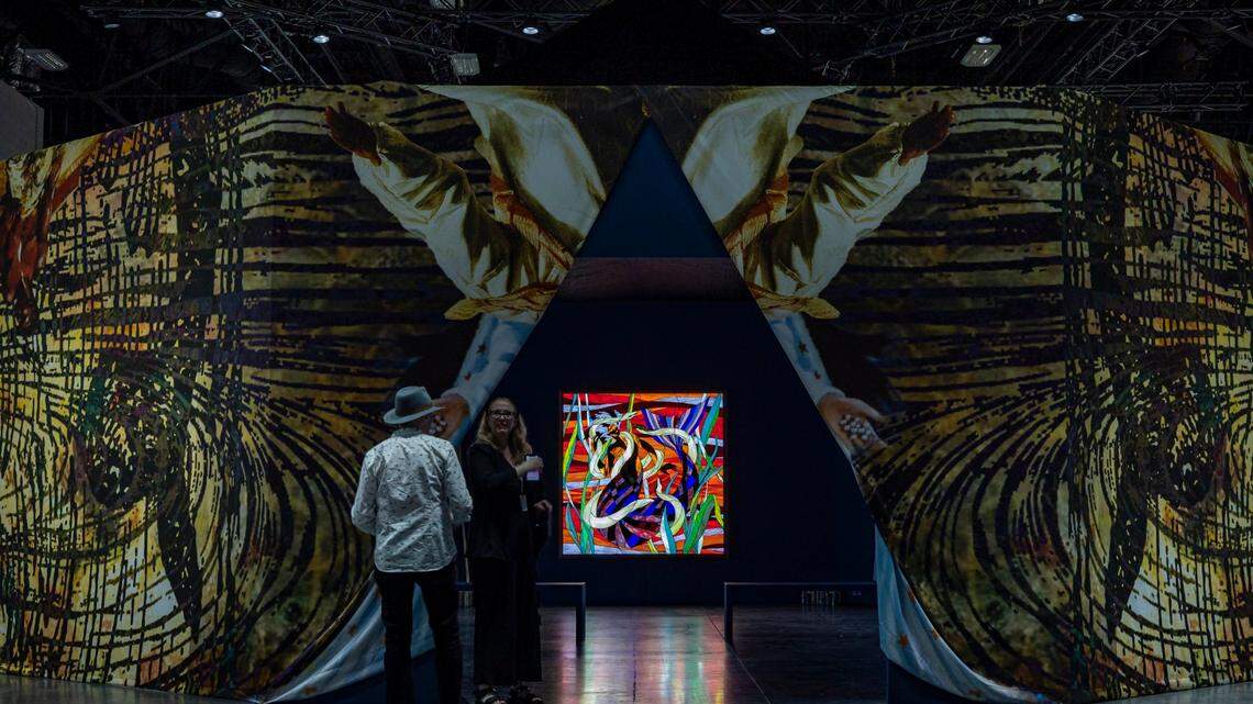 Miami Beach, FL- November 29, 2022 - Entrance to Christopher Myers’ Let the Mermaids Flirt with me, 2022 a piece consisting of stained glass light boxes, at the Meridians sector during Art Basel VIP opening day at the Miami Beach Convention Center.