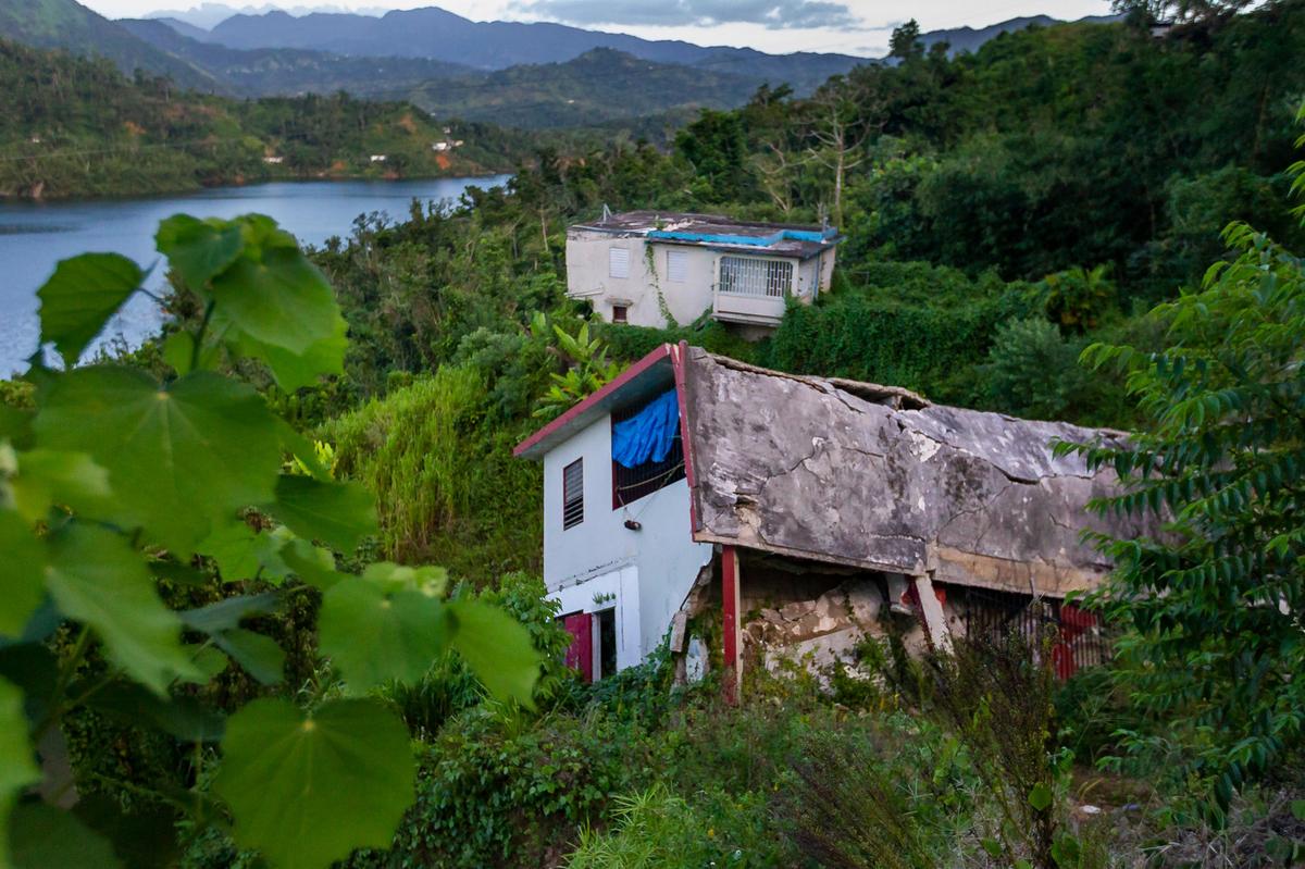 A collapsed home in Utuado, Puerto Rico. Abandoned homes like this one are common in the city of Utuado, where people continue to recover a year after Hurricane Maria devastated the area.