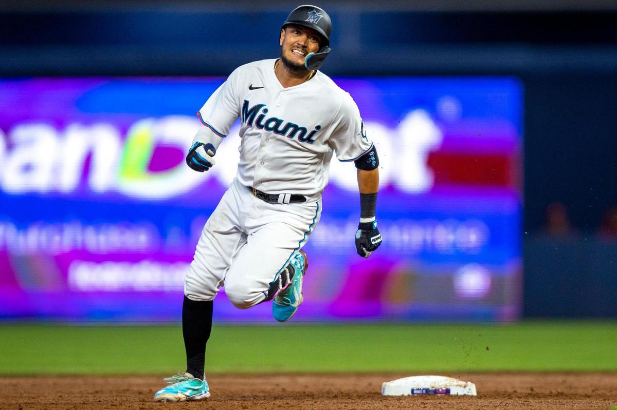 Miami Marlins base runner Miguel Rojas rounds third base before scoring during the second inning of a baseball game against the Philadelphia Phillies at LoanDepot Park on Sunday, April 17, 2022 in Miami, Florida.