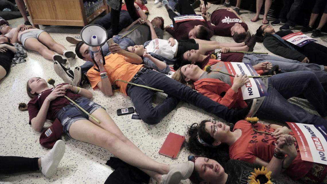 Protesters lie on the floor of the Publix store in Coral Springs for a 12 minute ‘die-in’ to protest Publix’s support for Adam Putnam’s gubernatorial campaign. Putnam had called himself a ‘proud sellout’ to the National Rifle Association.
