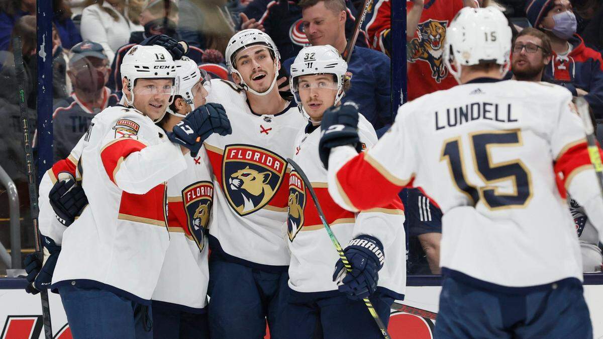 Florida Panthers players celebrate their goal against the Columbus Blue Jackets during the first period of an NHL hockey game Monday, Jan. 31, 2022, in Columbus, Ohio. (AP Photo/Jay LaPrete)