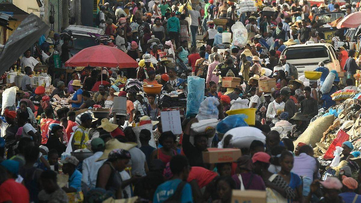 Street vendors work despite a continued general strike in Port-au-Prince, Haiti, Tuesday, Oct. 26, 2021. Worker unions along with other Haitians called for a general strike to demand the end of kidnappings, violence and insecurity in the streets.