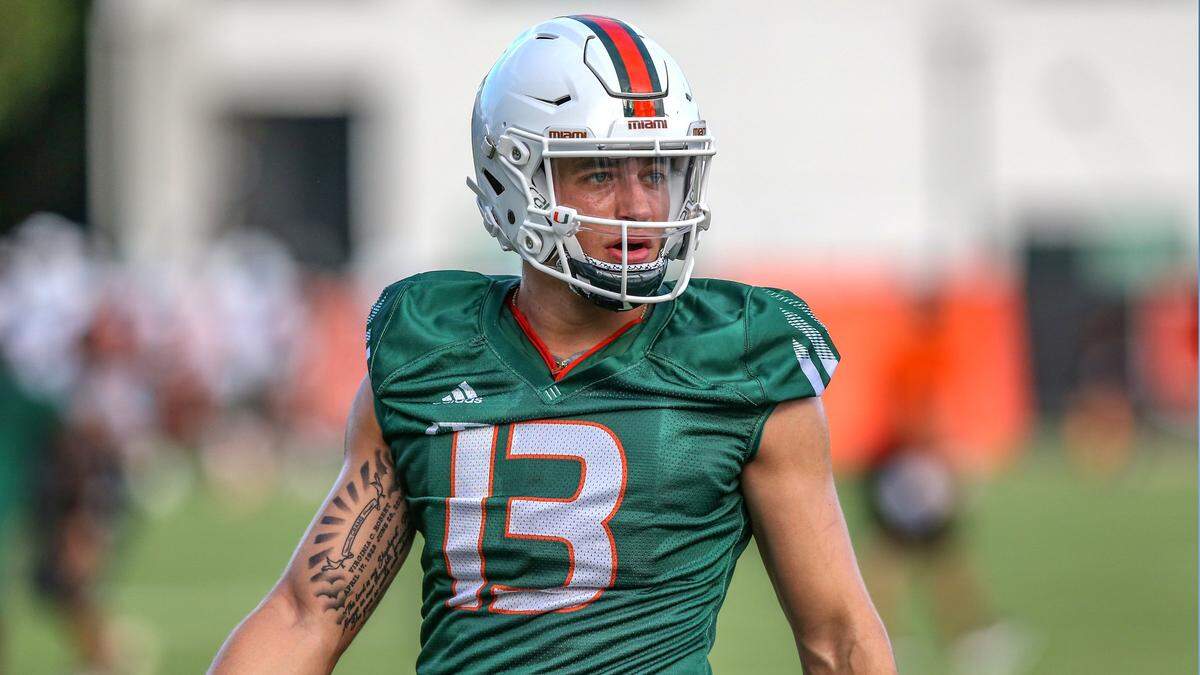 Miami Hurricanes quarterback Jake Garcia (13) looks down field during practice at the University of Miamis Greentree Practice Field in Coral Gables on Saturday, August 7, 2021.