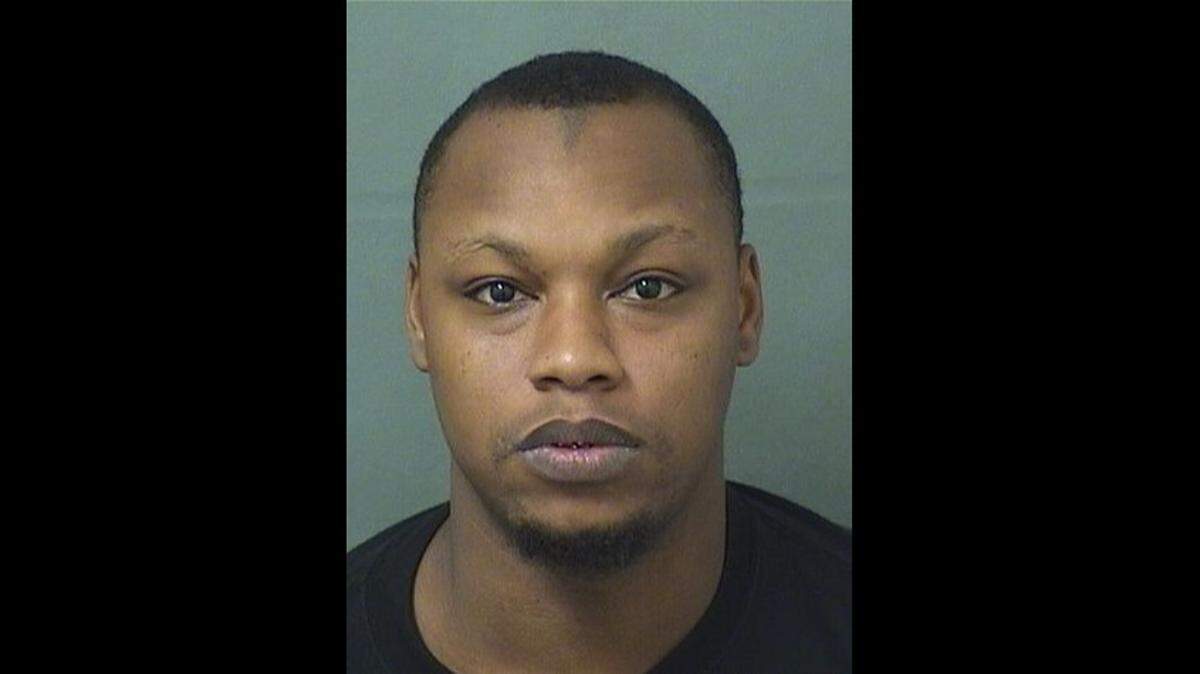Zhane Carn, 30, was given 24 charges for the guns and drugs in his home, and for trying to run over two Palm Beach deputies.