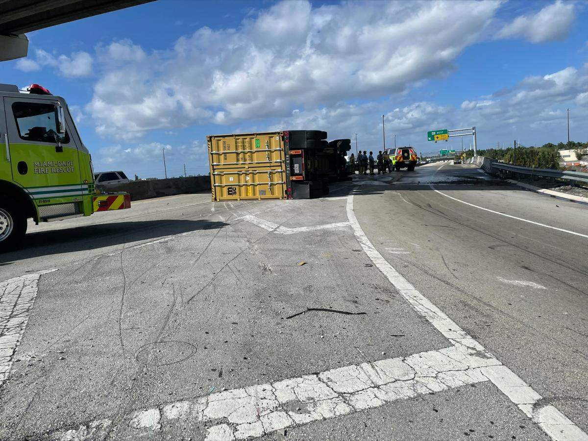 The fuel spill from this overturned orange tractor trailer has part of the Golden Glades shut down Wednesday afternoon