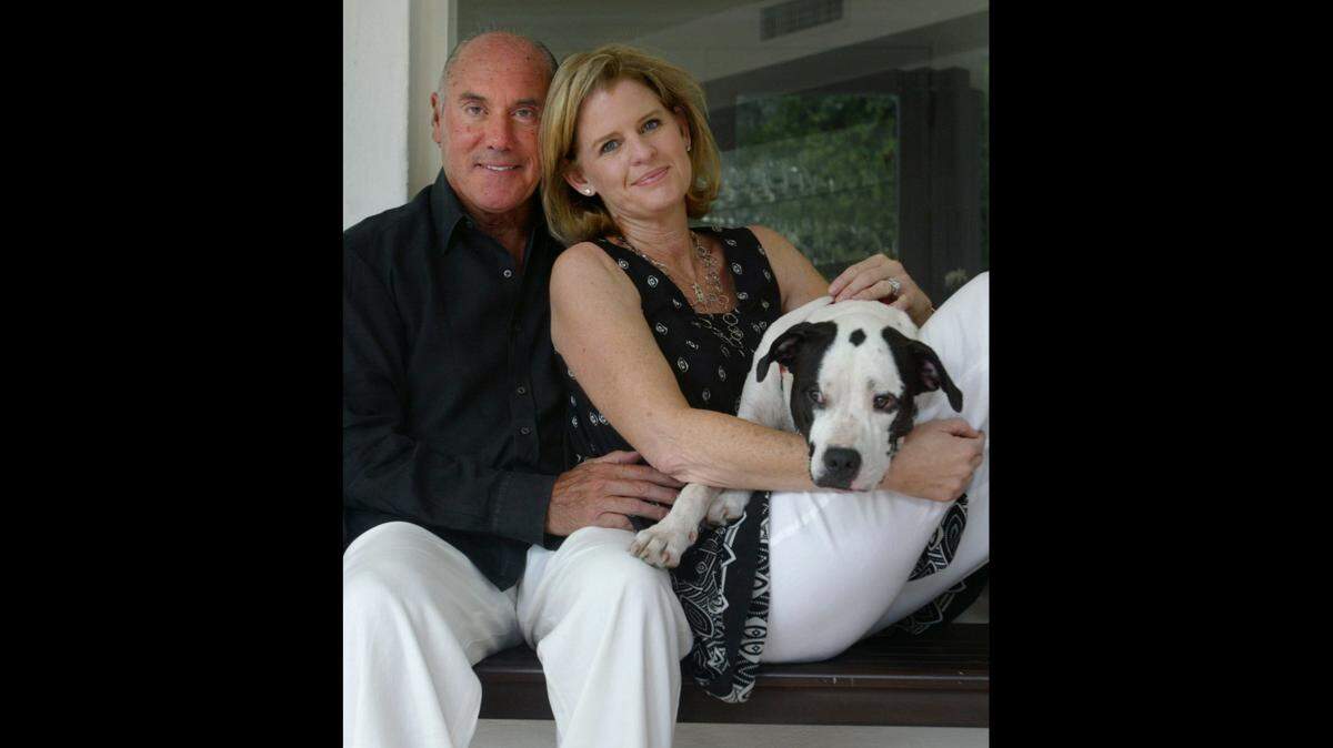 In this 2007 photo, Chris and Bob Caporale and their dog Jada.