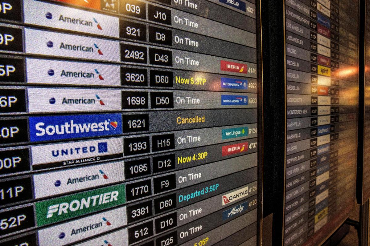Information monitors show Southwest Airlines’ canceled flights at Miami International Airport on Tuesday, Dec. 27, 2022, as the airline canceled more than 60 percent of its flights for Tuesday and Wednesday due to winter weather, frustrating many travelers across the U.S.