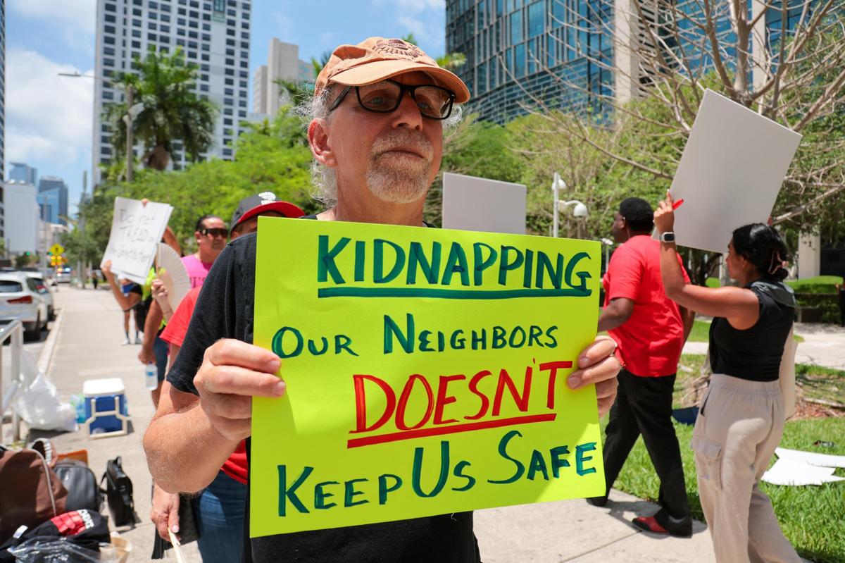 Jonathan Fried protests outside the Wilkie D. Ferguson Jr. U.S. Courthouse in downtown Miami, Florida, Thursday, May 29, 2025. The same day, a Miami federal judge held a hearing on whether to hold Florida Attorney General James Uthmeier in contempt of court in a politically fraught immigration case. She held off making a decision.