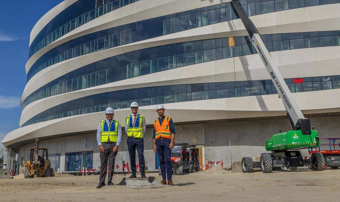 Mount Sinai Medical Center CEO,Gino R. Santorio (center) with COO Angel Palin (far left) and AVP Construction Services Matt Bernard, stand in front of the Irma and Norman Braman Comprehensive Cancer Center, building that is under construction, at the Mount Sinai's, Miami Beach Campus, in Miami, on Friday August 29, 2025.