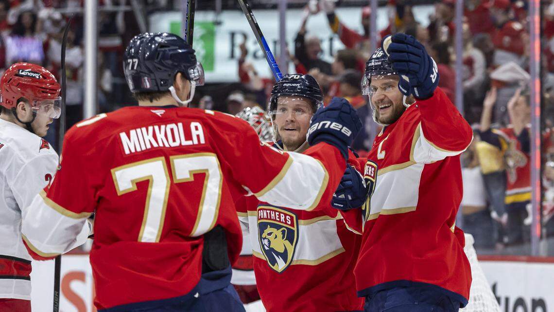Florida Panthers defenseman Niko Mikkola (77) celebrates with his teammates after scoring against Carolina Hurricanes goaltender Pyotr Kochetkov (52) in the first period of Game 3 during the Eastern Conference final of the NHL Stanley Cup playoffs at Amerant Bank Arena on Saturday, May 24, 2025, in Sunrise, Fla.