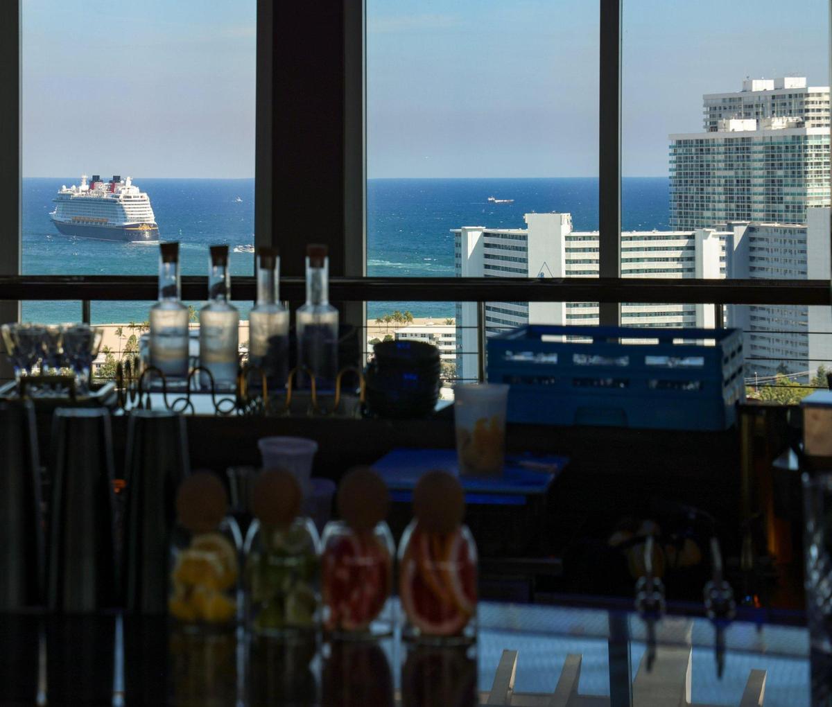 A cruise ship leaves Port Everglades, viewed from the rotating lounge Pier Top at Pier Sixty-Six.