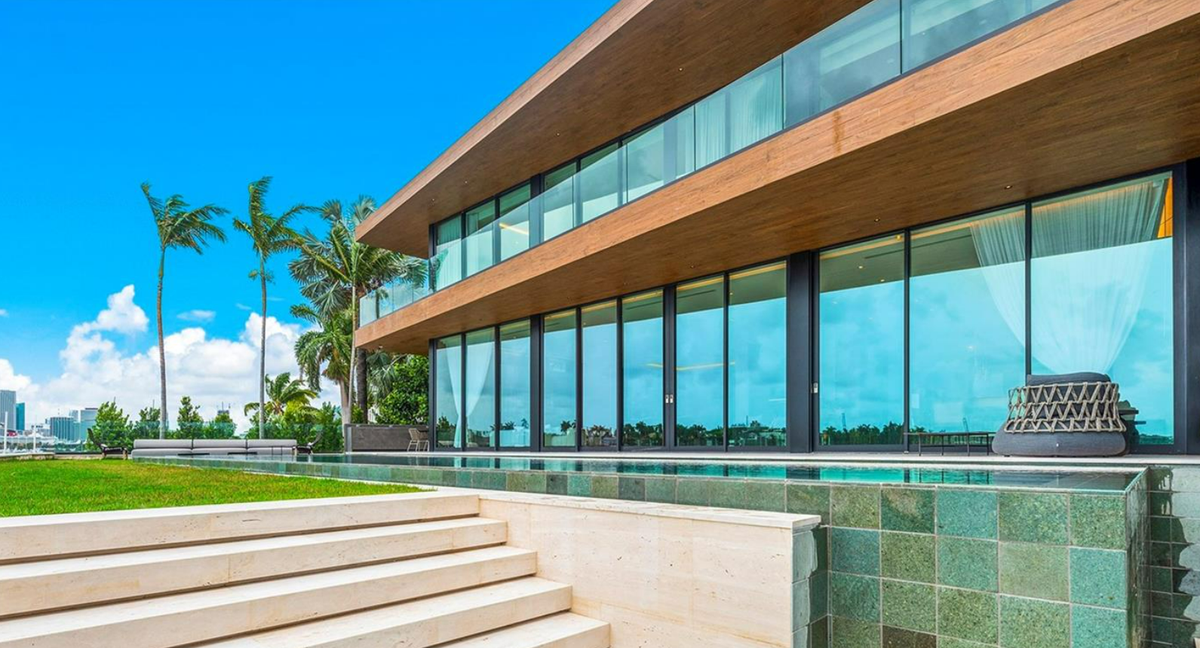 Located along the Venetian Islands, the recently completed house has a rooftop deck, dock, spa and pool.