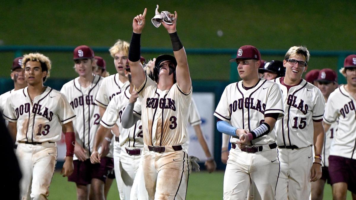 Stomeman Douglas players celebrate after beating the Plant Panthers in the Class 7A baseball state championship game in Fort Myers, Fla. on Wednesday night