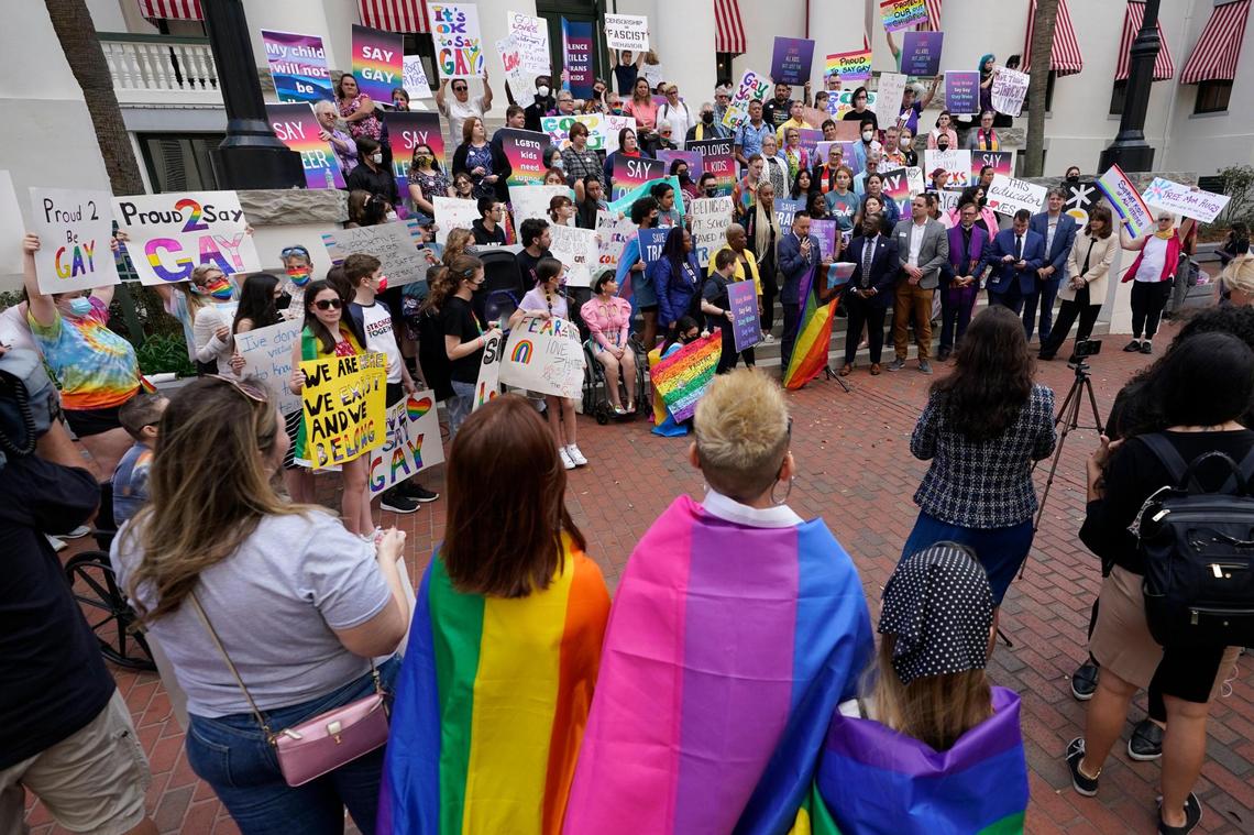 Demonstrators gather on the steps of the Florida Historic Capitol Museum in front of the Florida State Capitol, Monday, March 7, 2022, in Tallahassee, Fla.