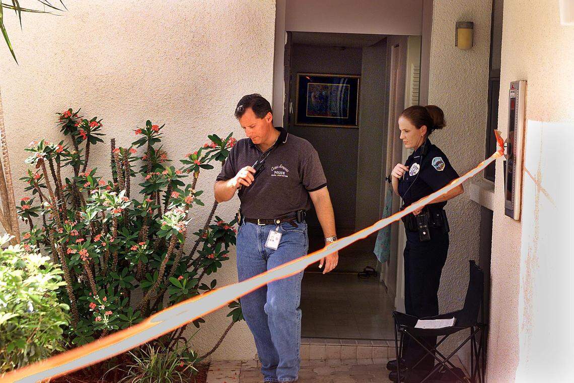Police stand guard outside Apt. 101 at 8409 Forest Hill Blvd. in Coral Springs after Odessia DonnaMarie Stephens, 24, and her daughter Hanesia Mullings, 4, were killed in 2000.