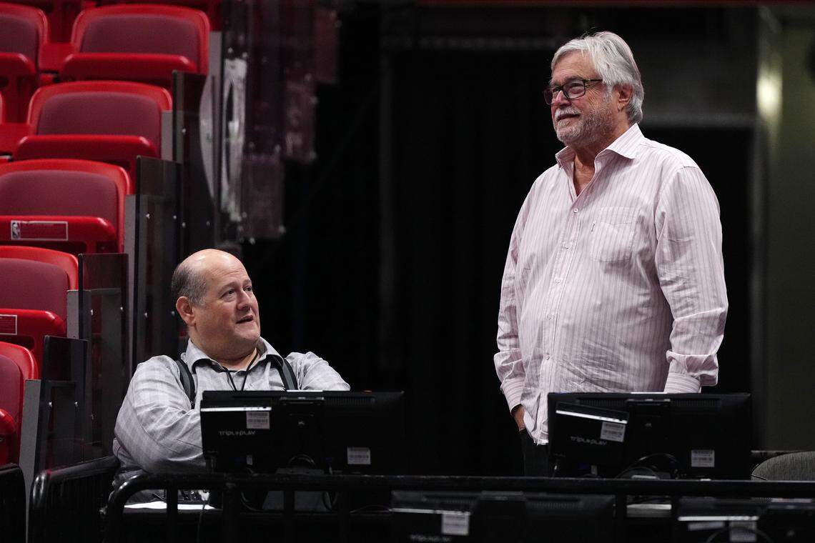 Miami Heat owner Micky Arison (R) talks with general manager Andy Elisburg (L) prior to the game between the Miami Heat and the Charlotte Hornets at Kaseya Center on Jan. 14, 2024.