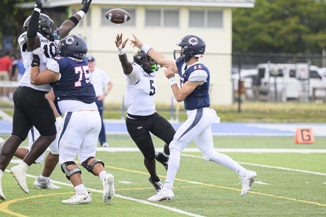 Columbus High School Quarterback Vincente Gonzalez(11) throws the ball during the game at Tropical Park on Friday, Nov. 29, 2024 in Miami, Fla. (Ruben Gonzalez/Miami Herald)