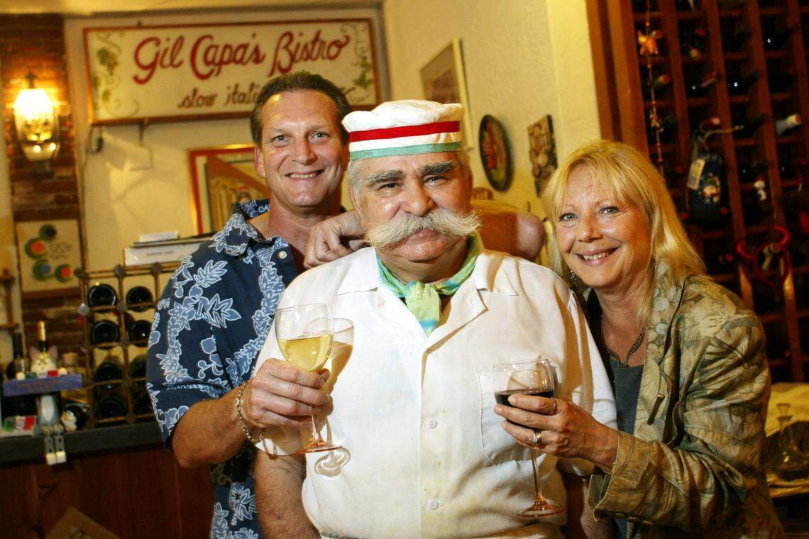In 2004, Tom Knieriem, and Kathi Knieriem Estevez, customers of Gil Capa’s Bistro, with restaurant owner and chef Gilberto Nalli.