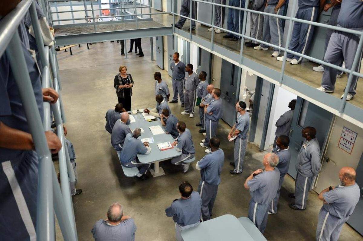 Florida Department of Corrections Secretary Julie Jones visits with Wakulla Correctional Institution inmates.
