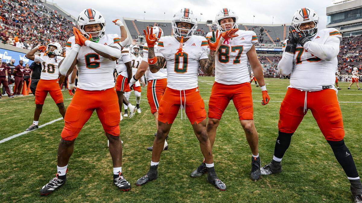 Miami Hurricanes wide receiver Malachi Toney (10), at far left, celebrates after his touchdown reception to seal the win. In front is running back Charmar Brown (6), wide receiver Keelan Marion (0), tight end Alex Bauman (87) and offensive lineman Anez Cooper (73) during the game against Virginia Tech Hokies late in the second half at Lane Stadium in Blacksburg, Virginia, on Saturday, November 22, 2025.