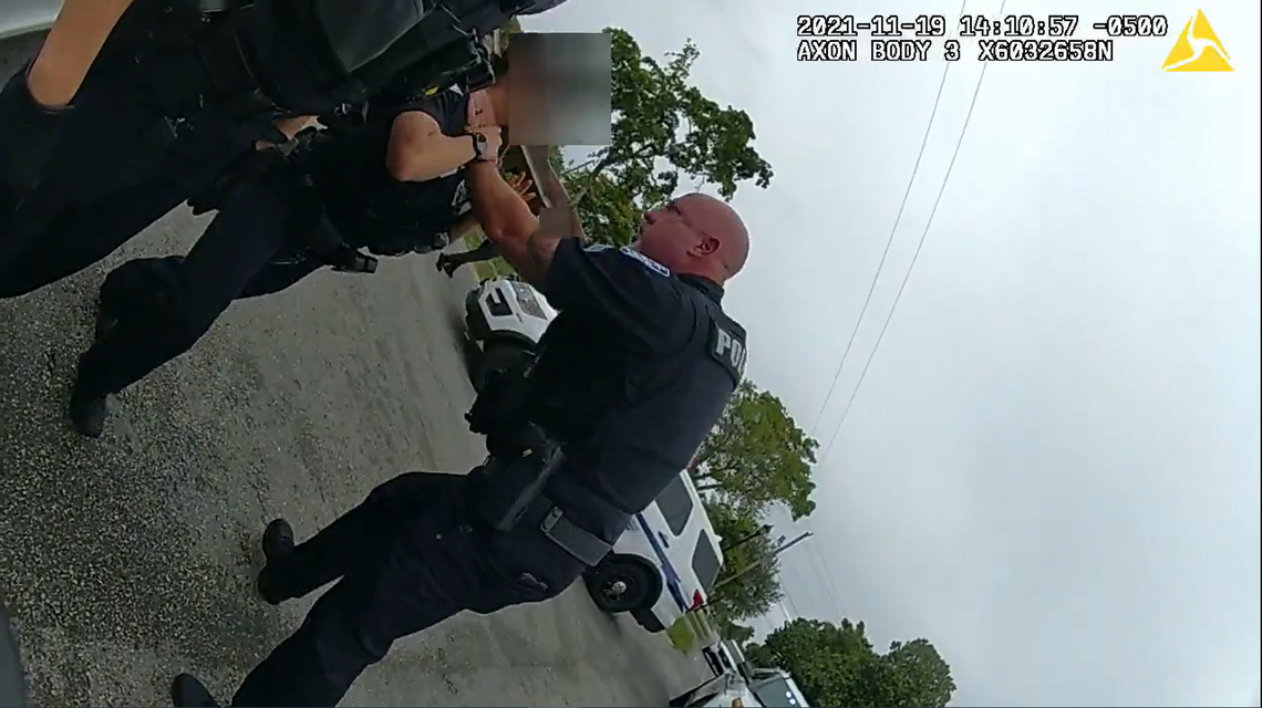 A screen capture of body-cam footage from Nov. 19, 2021 shows Sunrise police Sgt. Christopher Douglas Pullease grabbing an officer by her throat. The name of the officer was not released because she is a witness, police said.