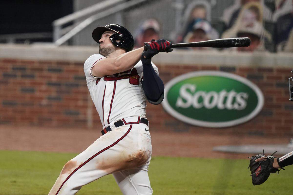 Atlanta Braves’ Adam Duvall (23) hits a home run in the fifth inning of a baseball game against the Miami Marlins on Wednesday, Sept. 9, 2020, in Atlanta.
