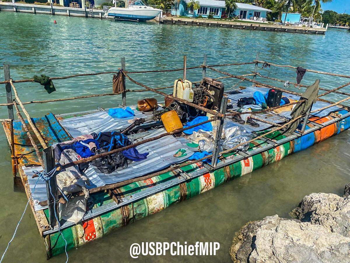 A makeshift pontoon boat is docked moored behind a neighborhood in the city of Marathon in the Florida Keys Tuesday, Feb. 8, 2022. Ten men from Cuba were on the vessel, according to the U.S. Border Patrol.